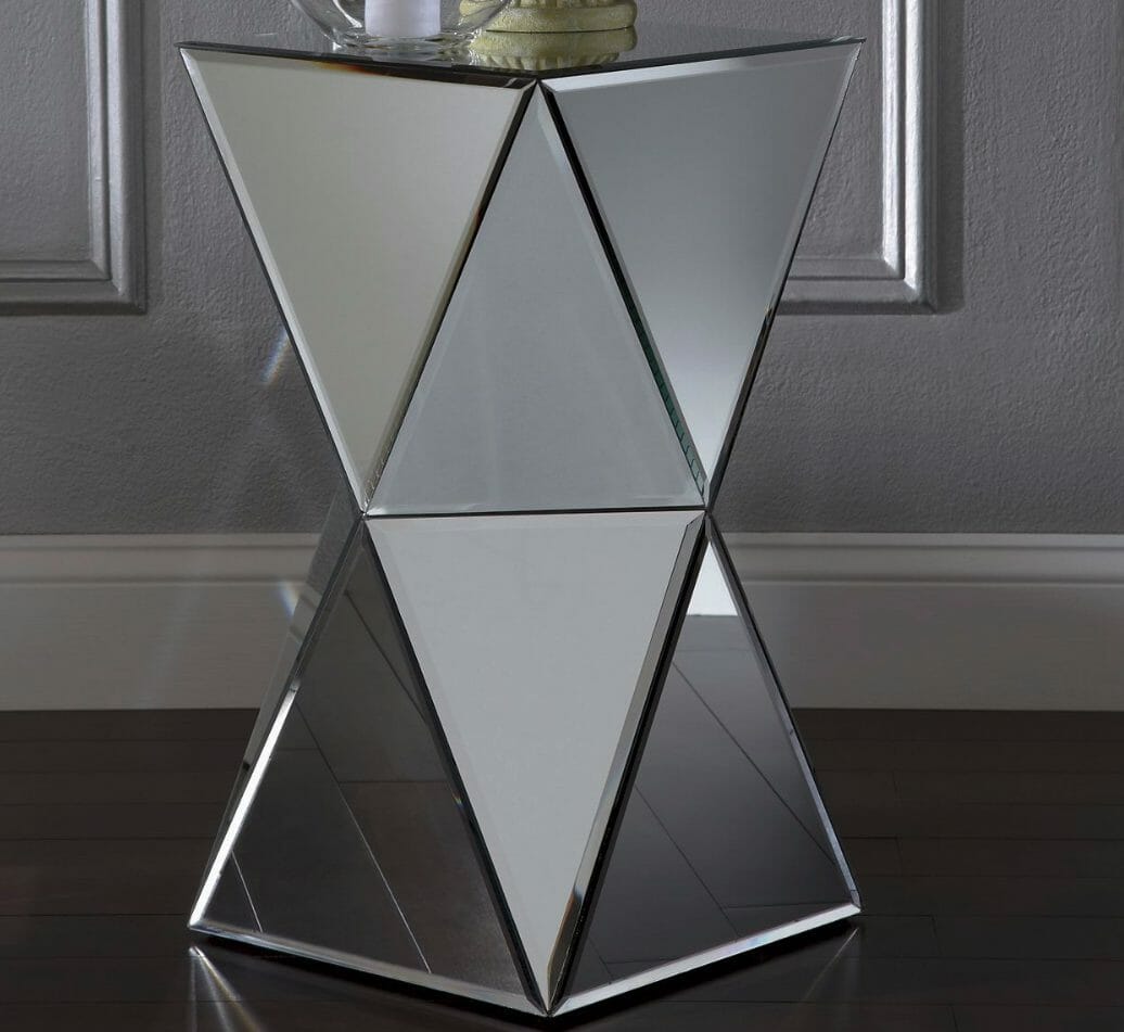 A cubist inspired stand created with sixteen triangular beveled mirrors, with a square mirror on the top.