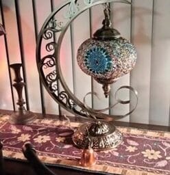 moon lamp on table in front of window