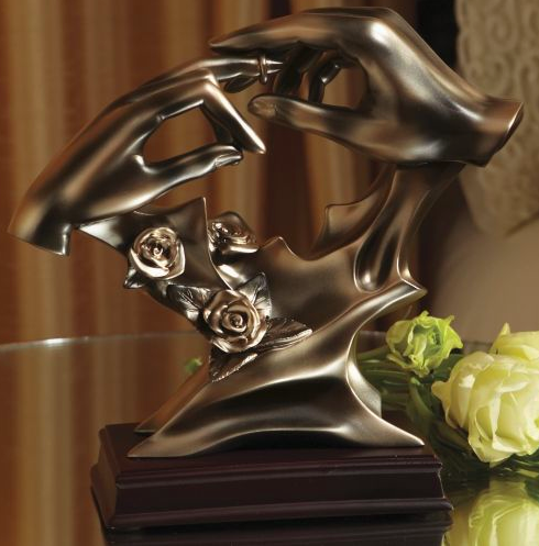 Celebrate a special couple and their love by showcasing a statue that honors the union of two hearts.