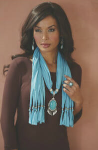 Silvertone beads and a faux turquoise stone transform this scarf into a bold statement piece.