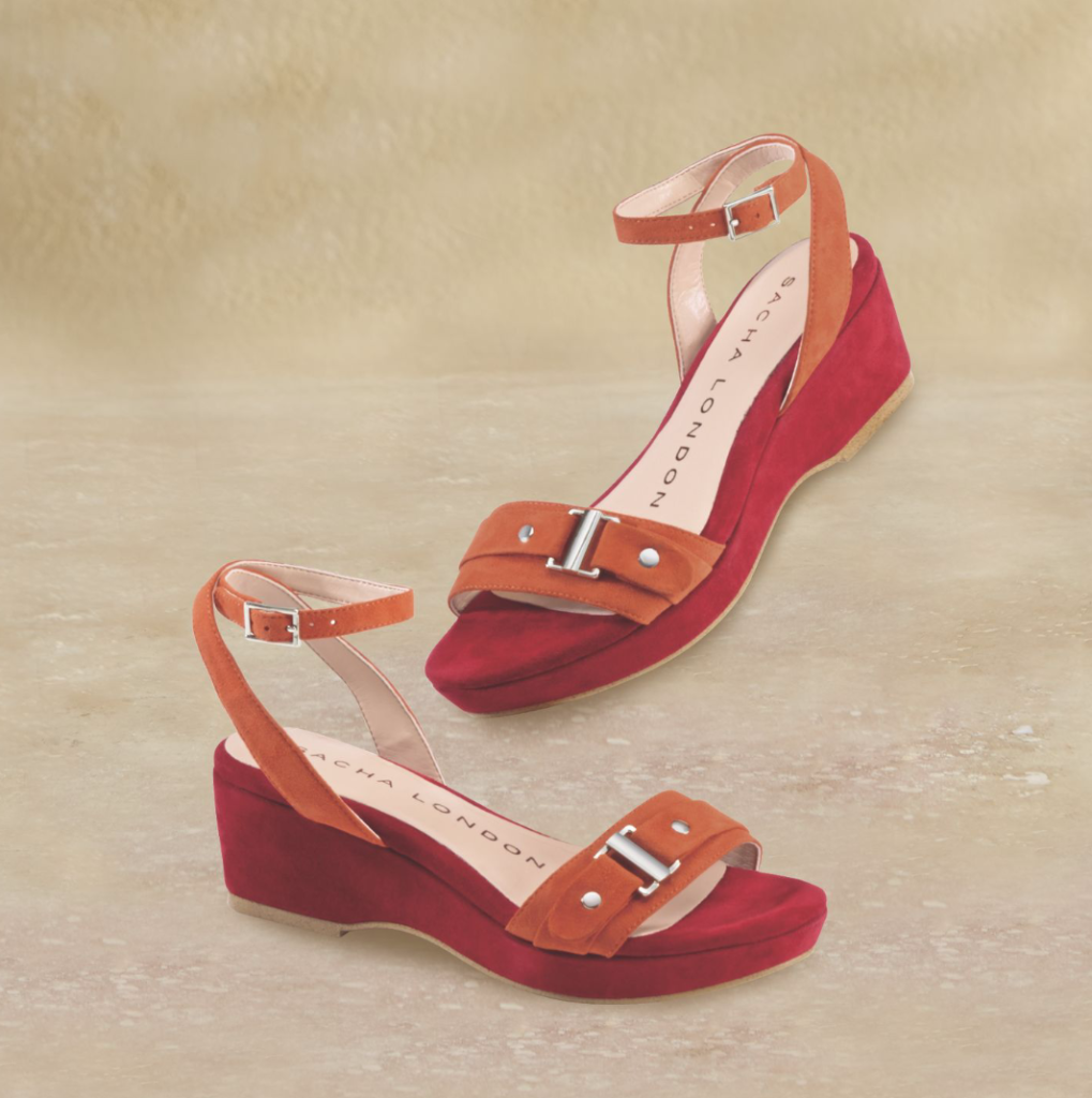Glamour Wedge by Sacha London: Hot orange and red, silvertone hardware and a wrap-around ankle strap bring the sizzle in this spicy suede wedge. 
