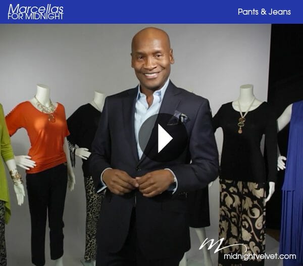 Marcellas for Midnight, video of a smiling black man in a suit, standing in front of mannequins dressed in pant sets.