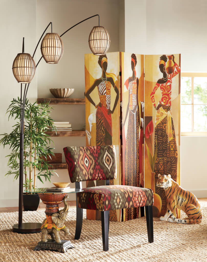 An Afrocentric print chair, a three panel screen of three African women, a tiger figurine, and an elephant glass top table.