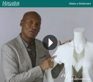 Marcellas For Midnight, Make a Statement, A video of a black man in a suit jacket, discussing jewelry on a mannequin.