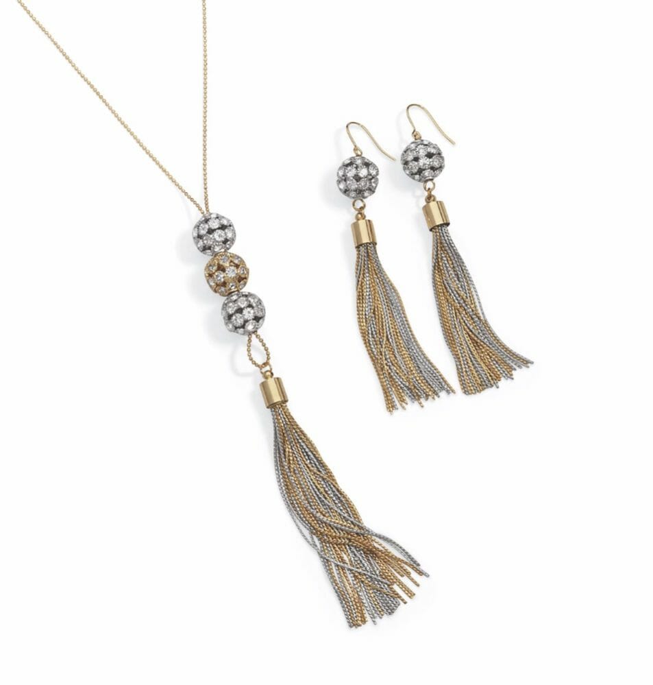 A silver and gold tassel necklace with three rhinestone balls above, with matching drop earrings.