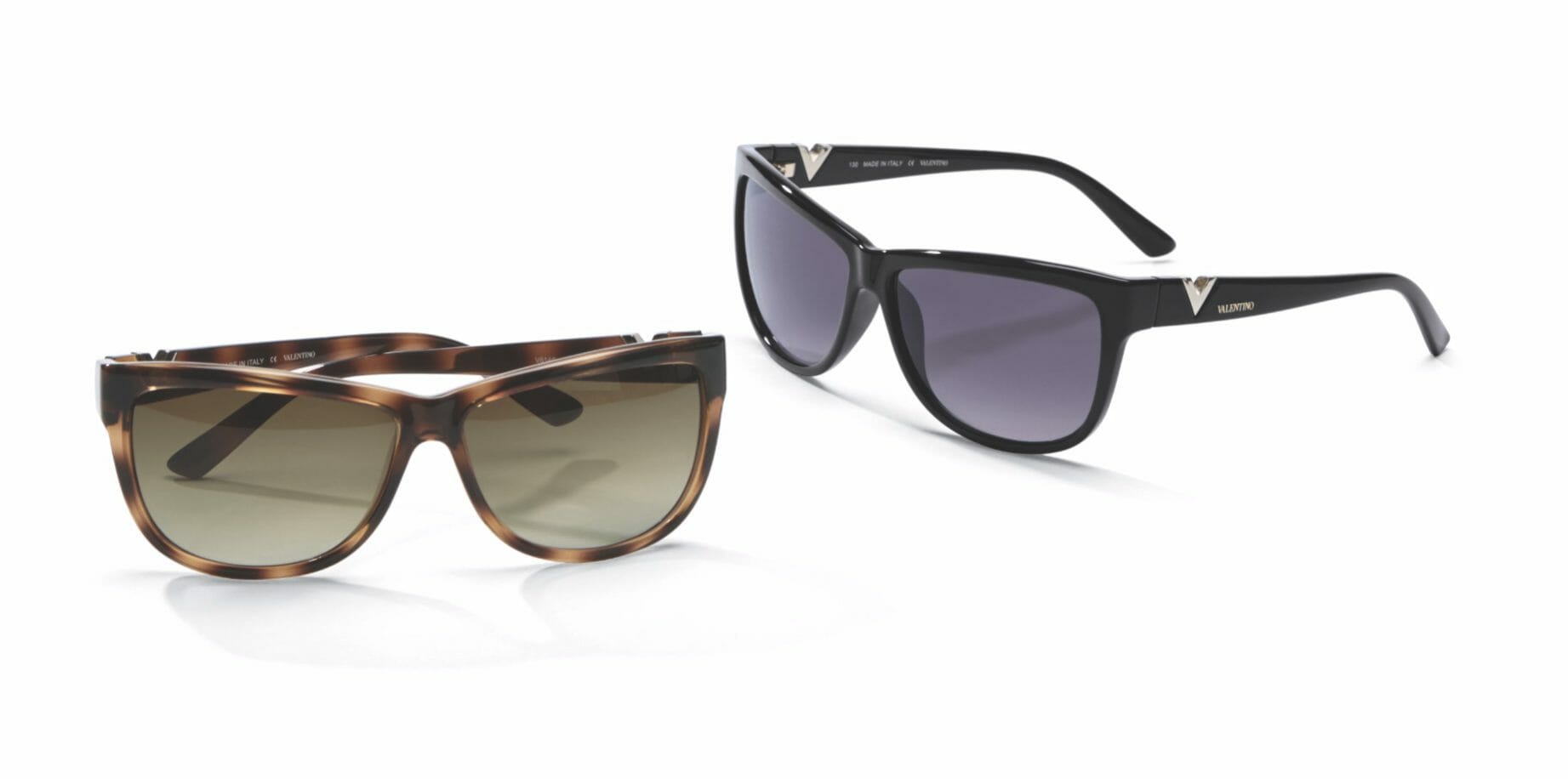 Two pairs of sunglasses, on in a brown tortoise shell frame and one in a black frame.