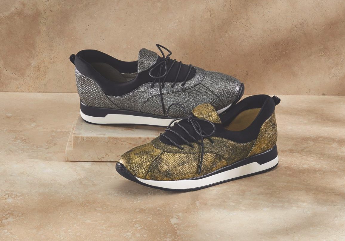 Two fancy faux snakeskin laced tennis shoes, one in brushed silver and black and one in brushed gold and black.