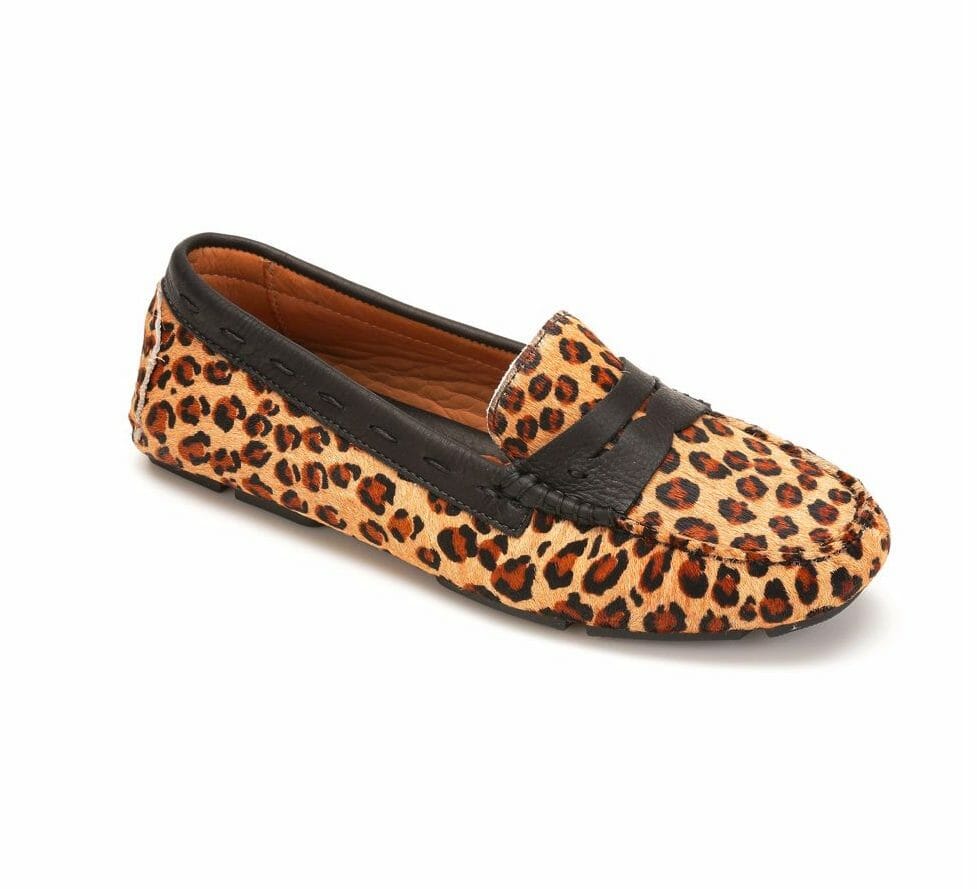 A flat moccasin loafer in a cheetah print with dark brown trim.