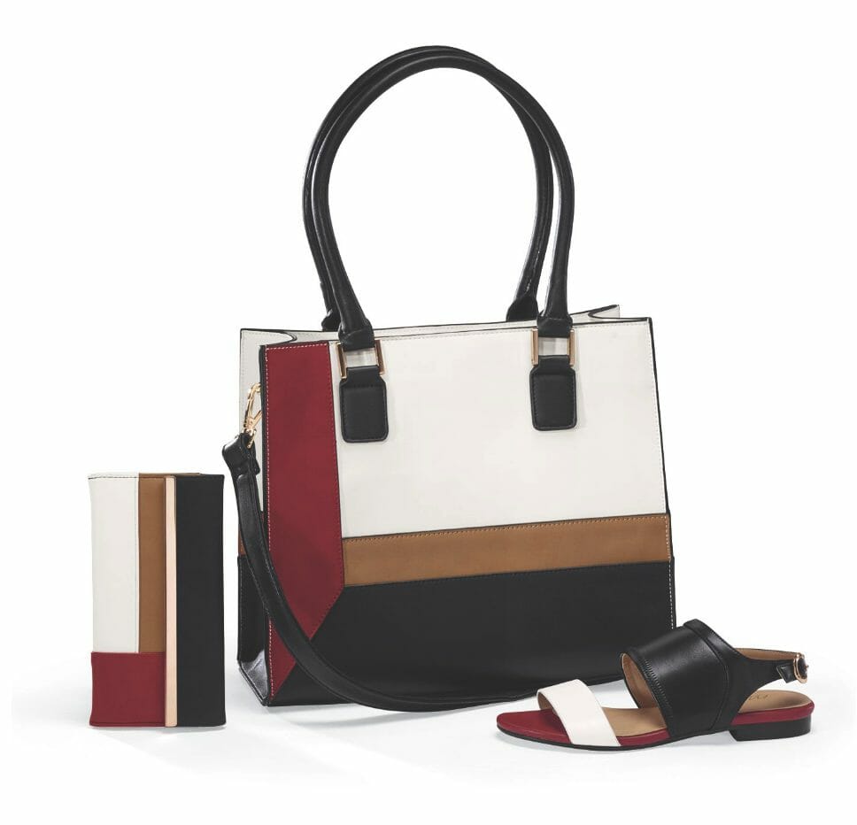 A colorblock tote in white, black, red, and tan, with a matching billfold and a matching sandal.
