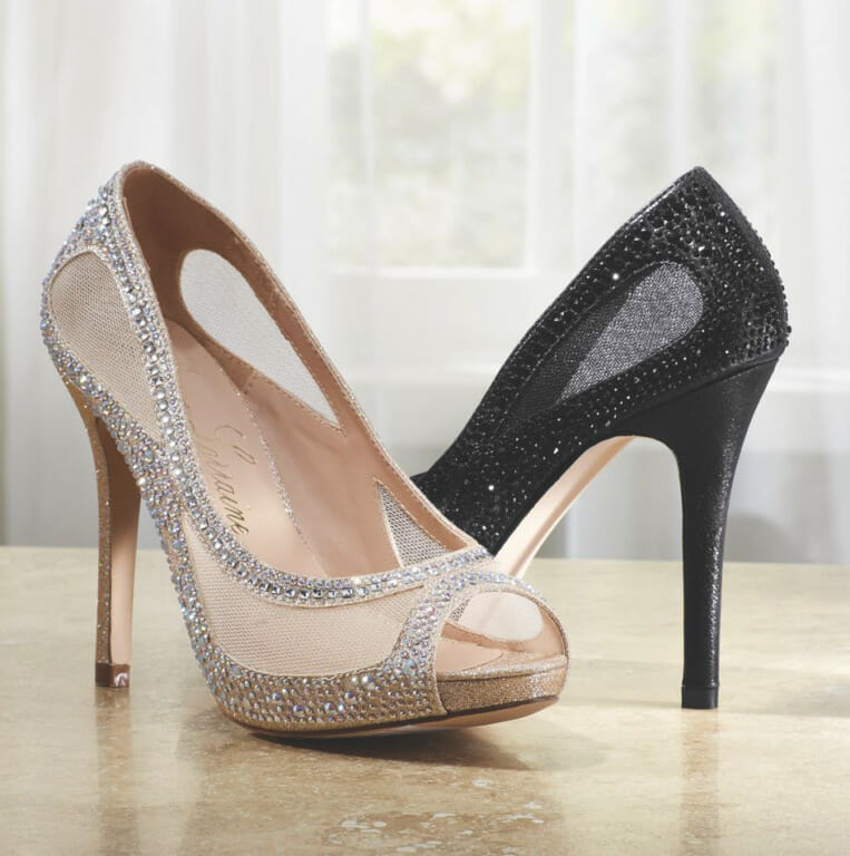Two classic open-toe stiletto heeled shoes with sparkle and mesh uppers, one in silver and one in black.