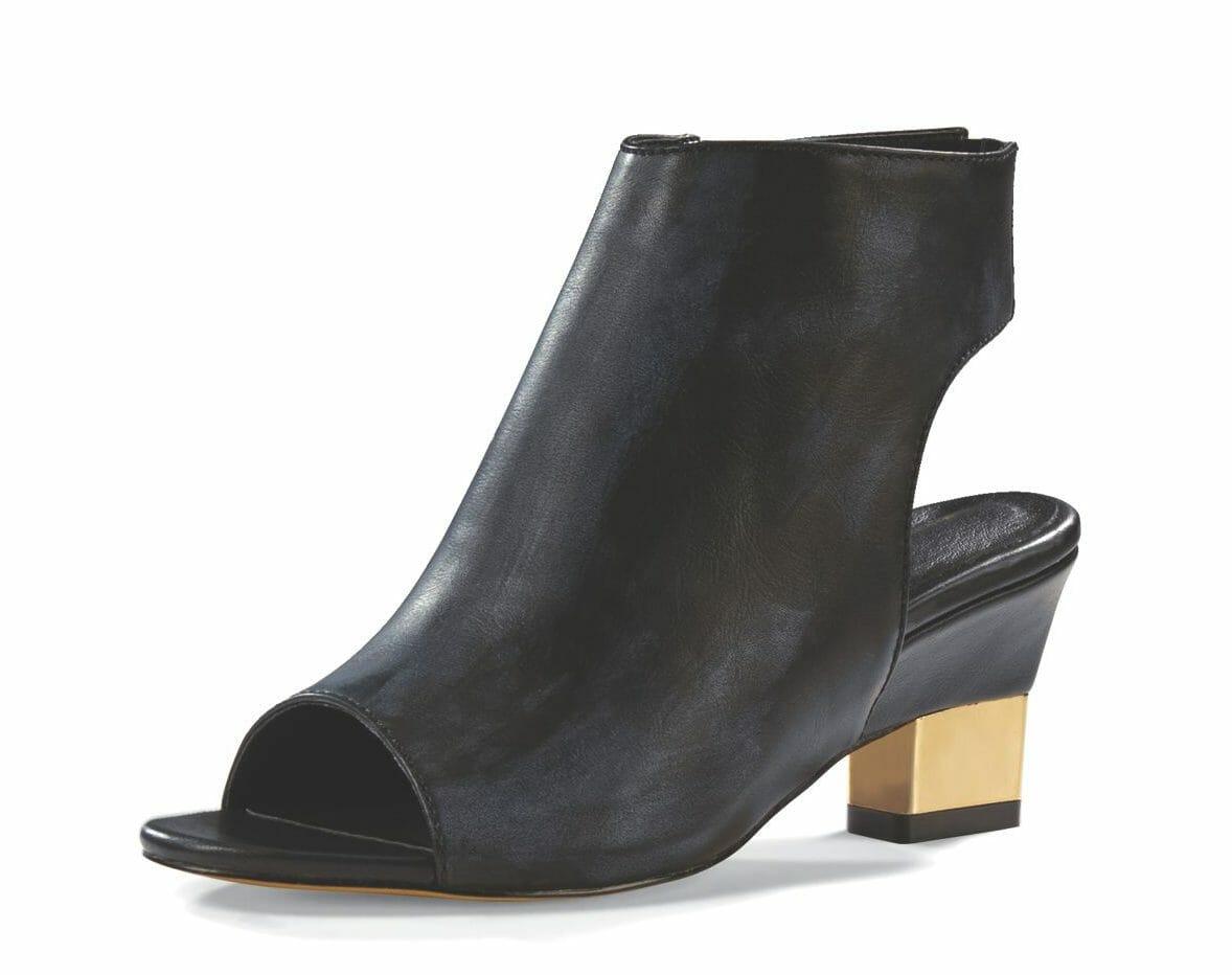 A single black faux leather bootie with an open heel area and toe, and a black and gold heel.