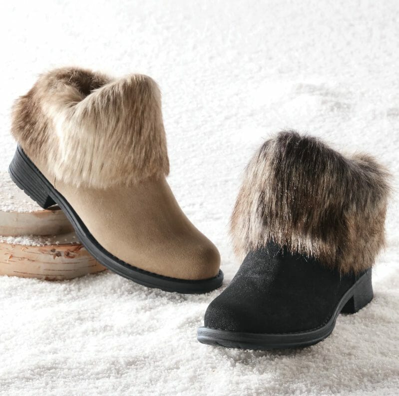 Two flat faux suede booties with faux fur cuffs, one in beige and one in black.