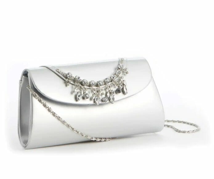 A dressy silver envelope clutch purse with beaded crystal trim and a silver shoulder chain.