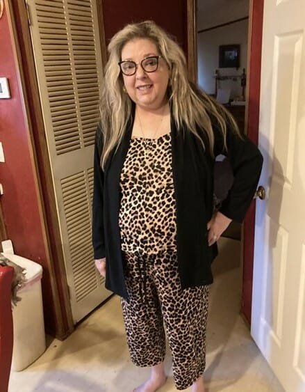 Blonde woman wearing glasses and Lounging Leopard set